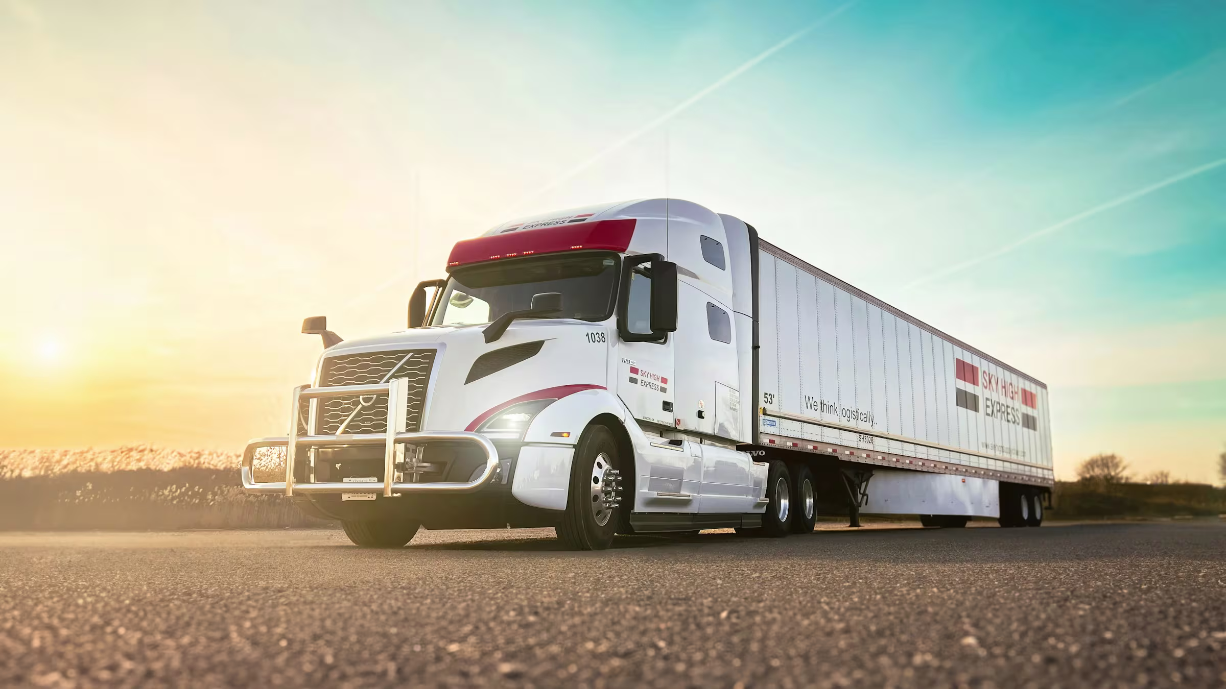 Cargo truck on an open road at dusk